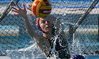 A Regals water polo player blocking the shot